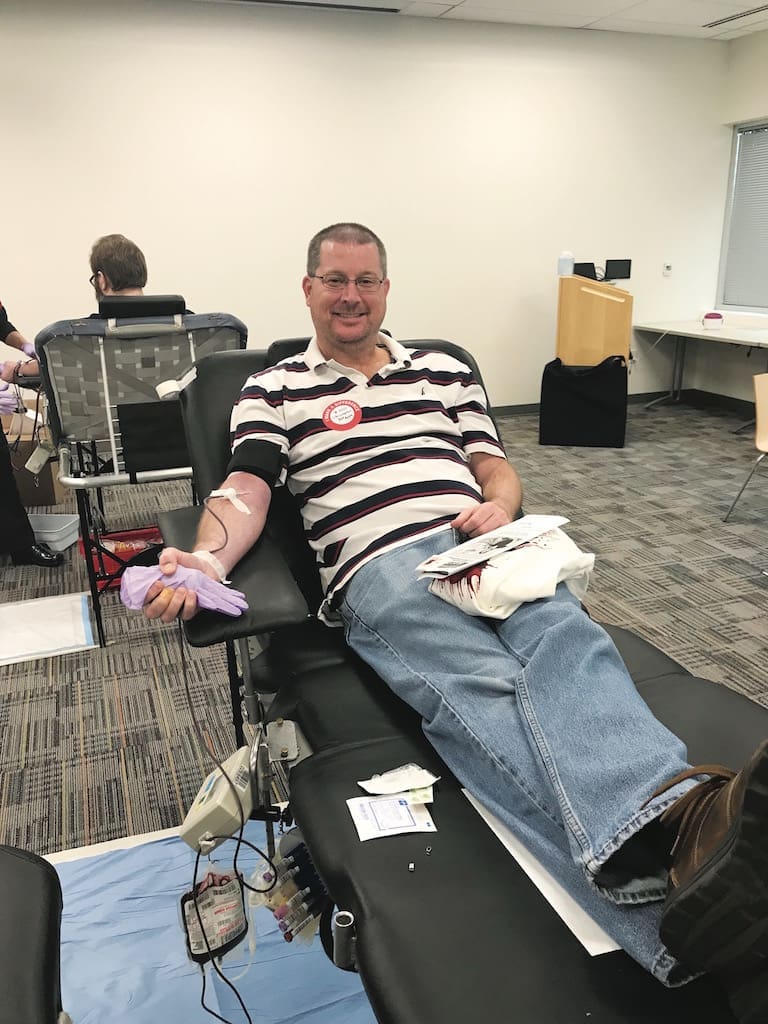 USAA employee giving blood