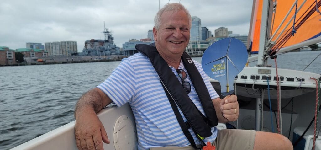 Photo of joe in a sailboat out on the water