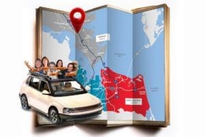 Map with bobbleheads riding in a car